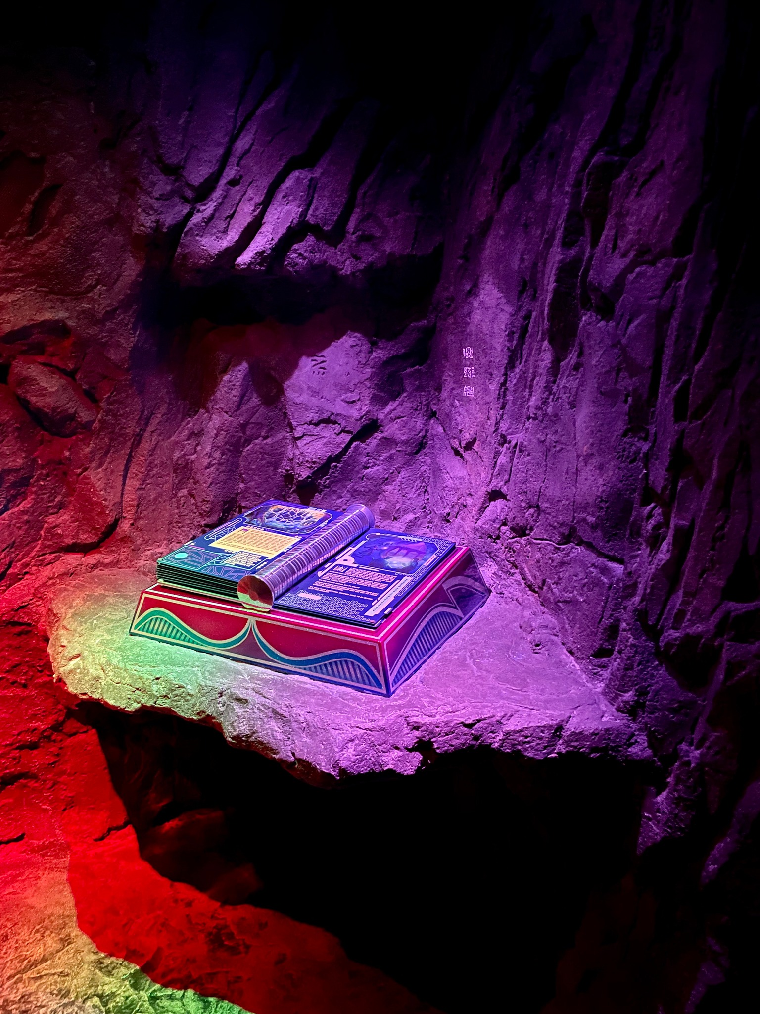 a colorful book in a small cave